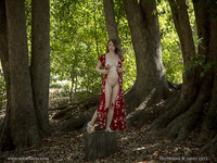 Pregnant girl undressed in the forest