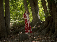 Pregnant girl undressed in the forest