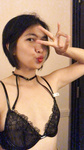 Tammy poses in a black bra