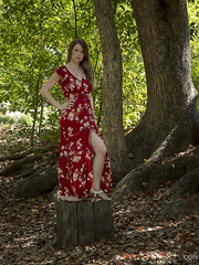 Pregnant girl undressed in the forest