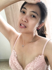 Tammy poses in a pink bra